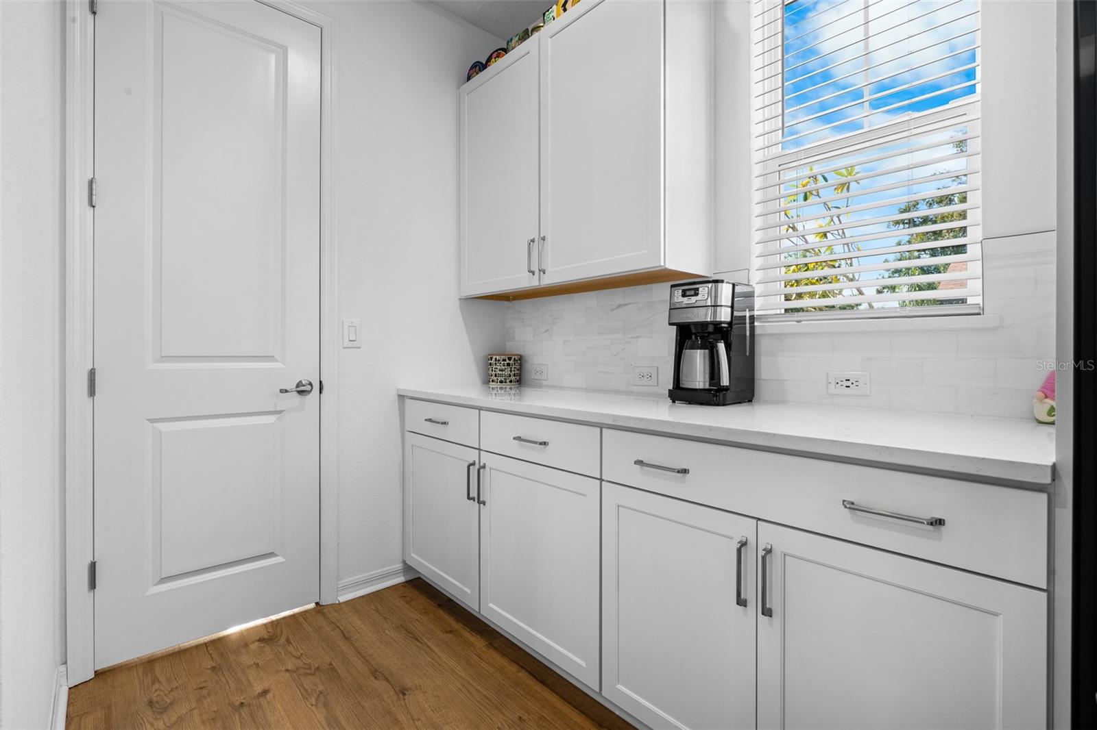 Additional counter and storage space and entry to walk in pantry.