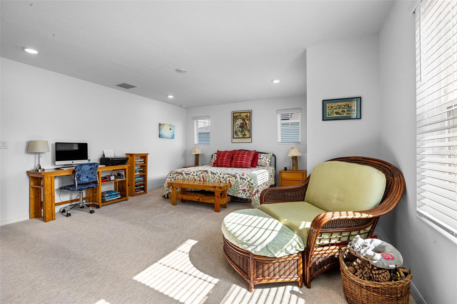 Large primary suite features a seating area and plenty of room for oversized furnishings.