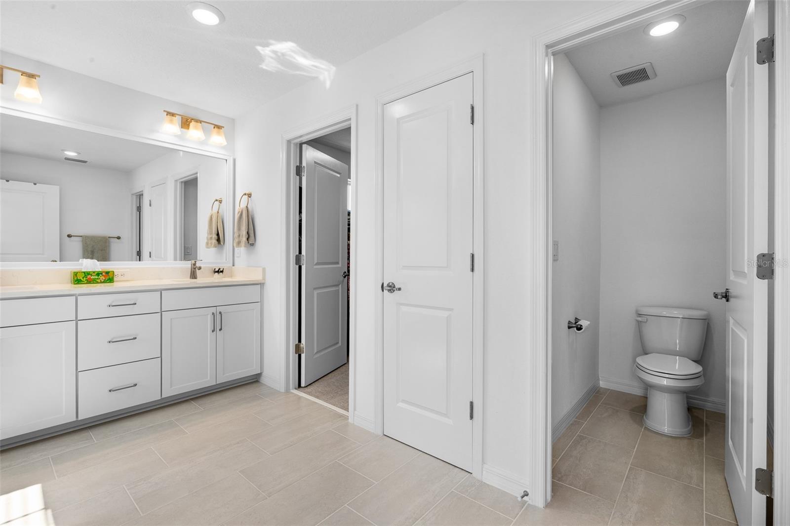 Private water closet in primary bath.