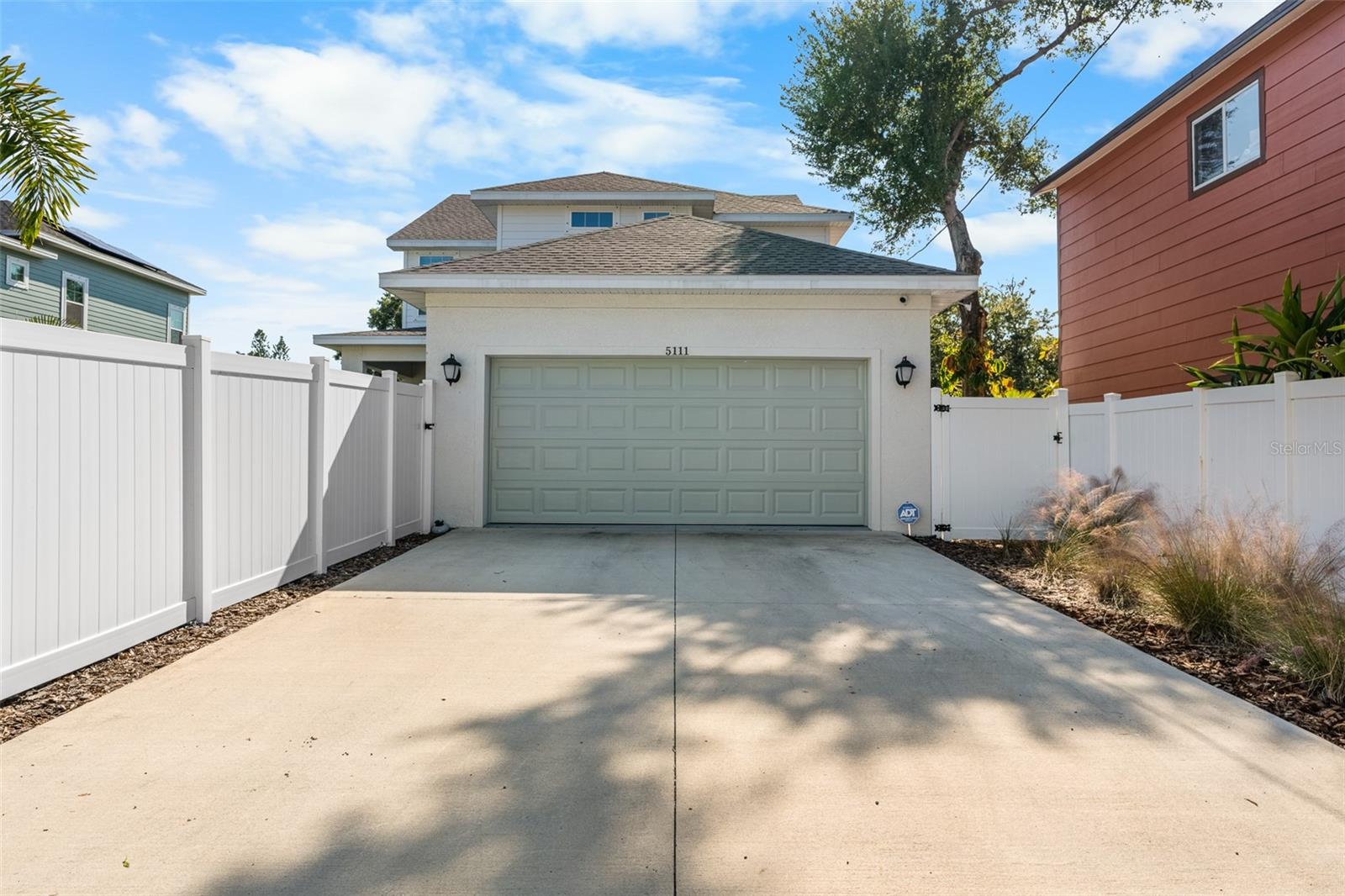 Two car attached garage and a large driveway provide plenty of parking.