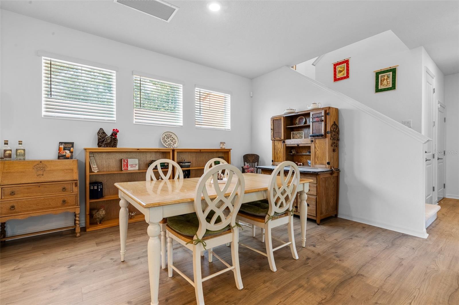Stairs behind the dining area lead to the second floor.