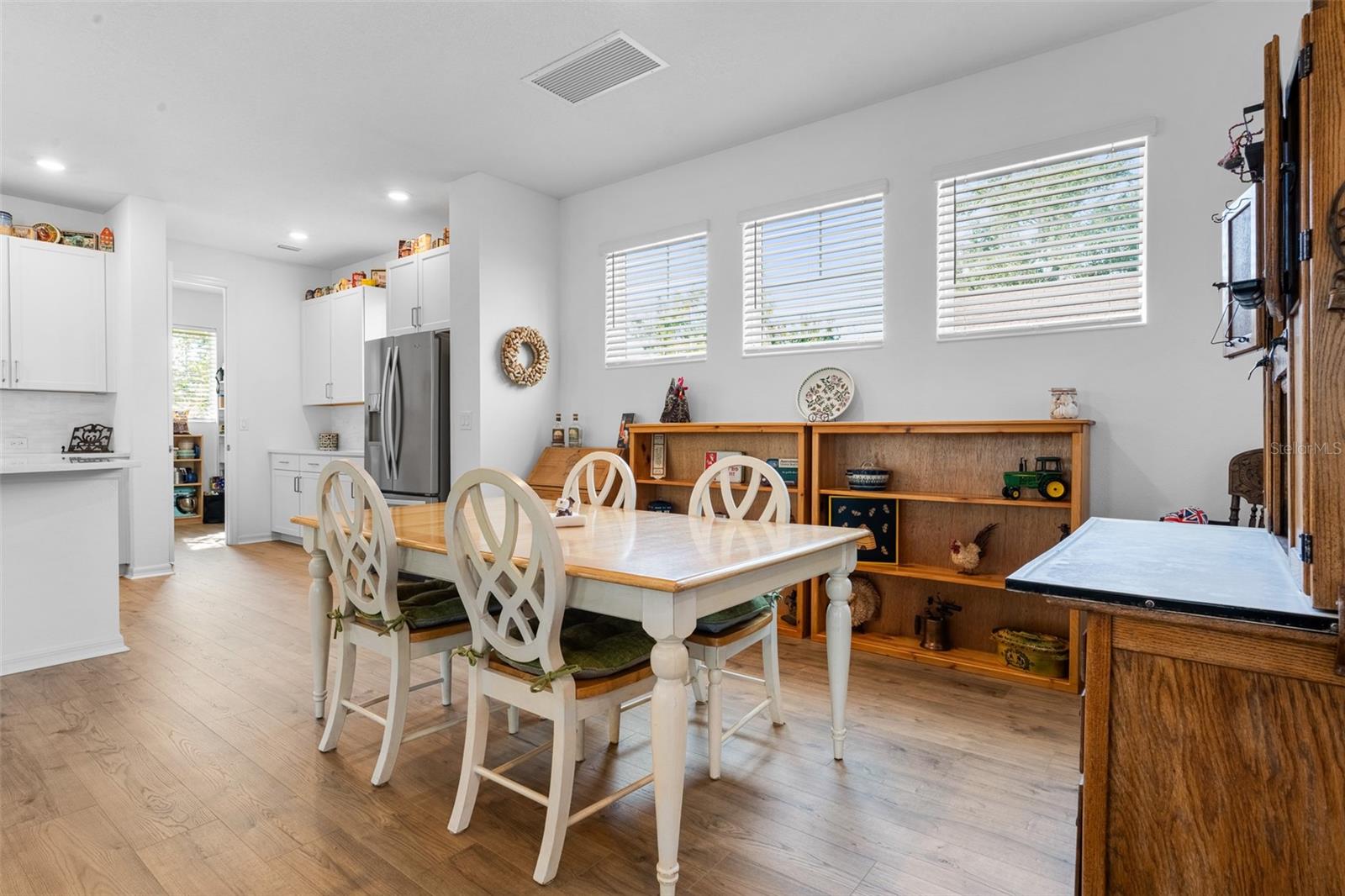 Dining room looking into the kitchen and walk in pantry.
