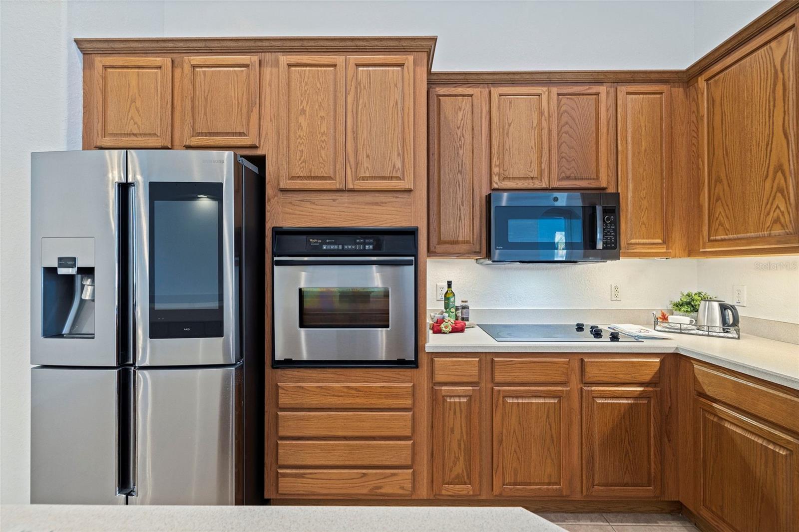 Built in Oven, High End Refrigerator, Cooktop (can be converted to gas service) and microwave