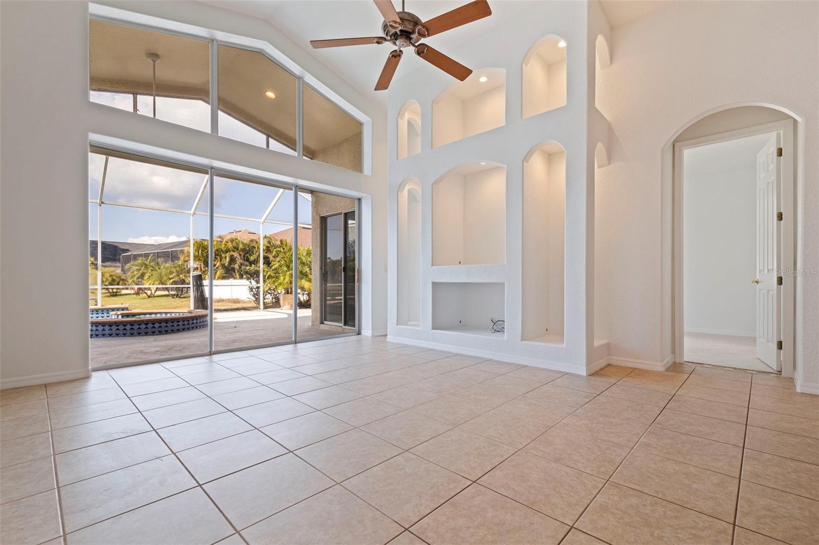 Family Room with Built-in Lighted Shelving & Power