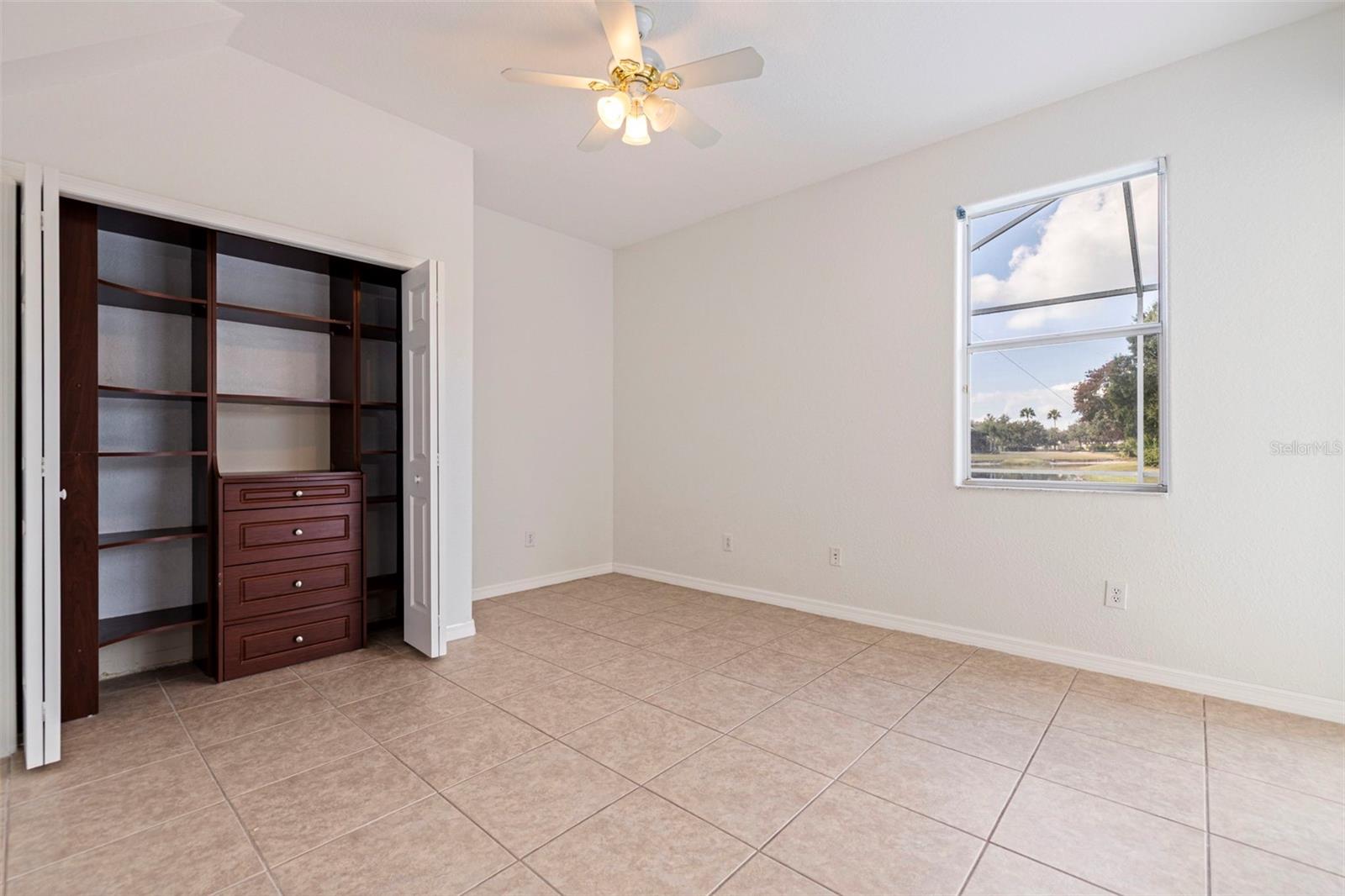 Bedroom #2 with ceramic tile & closet built-ins