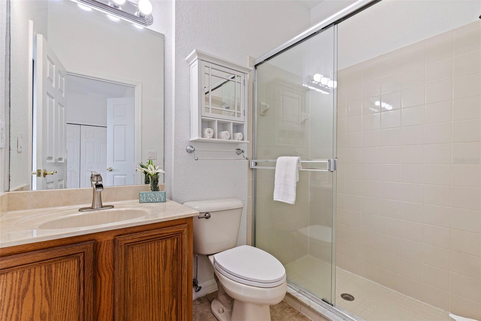 Ensuite Full bathroom for Bedroom #2 has Direct and Separate Access to Pool Patio