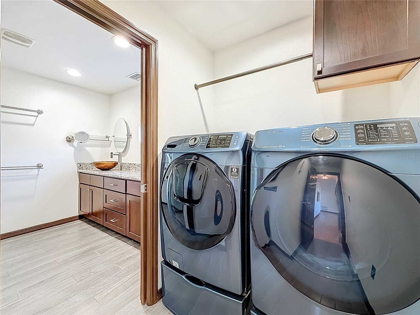 Laundry Room adjacent to Primary Suite