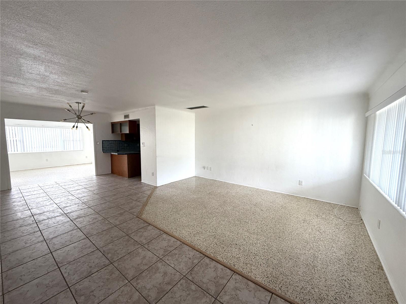 View from front entry of living rm, dining area, family room beyond. Kitchen on right.