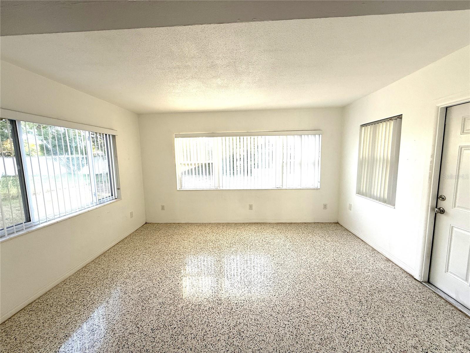 Family room off of the dining area ... door to screened Lanai.