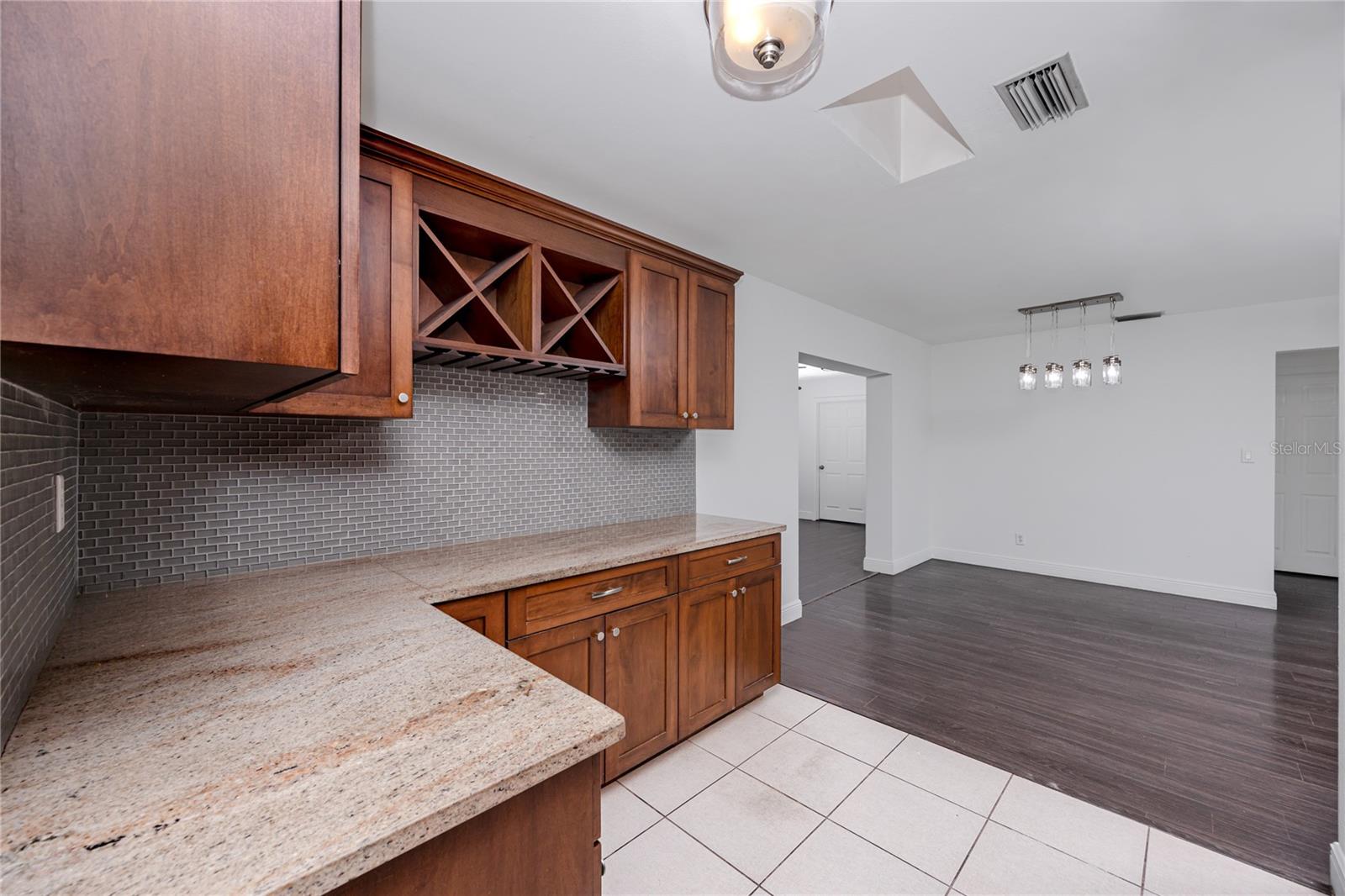 Beautiful granite countertops and elegant tile backsplash.