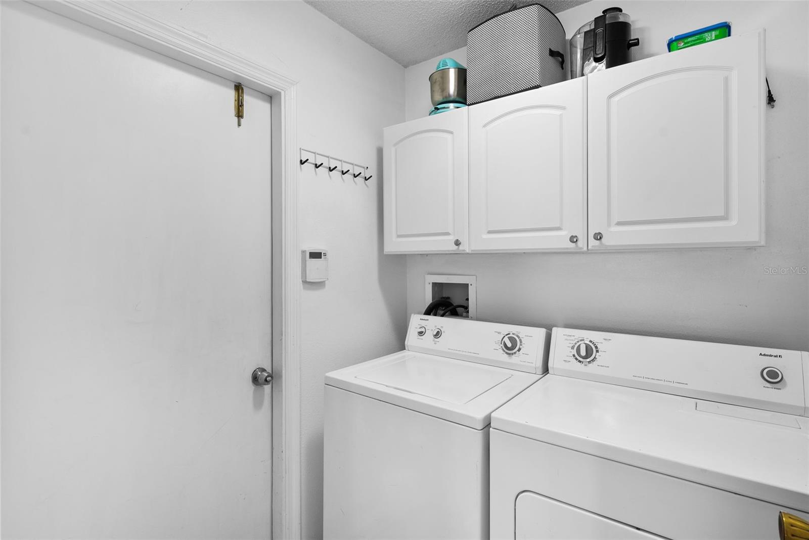 Laundry room with access door to the garage.
