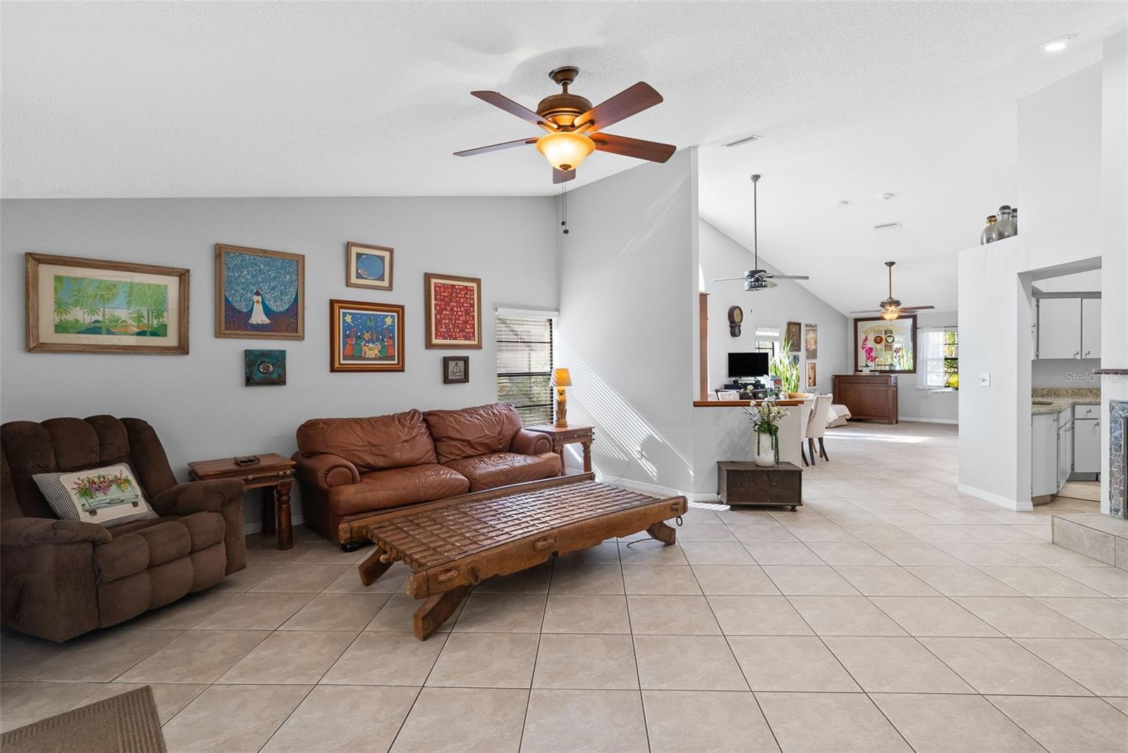 View of kitchen and dining/living room from the family room.