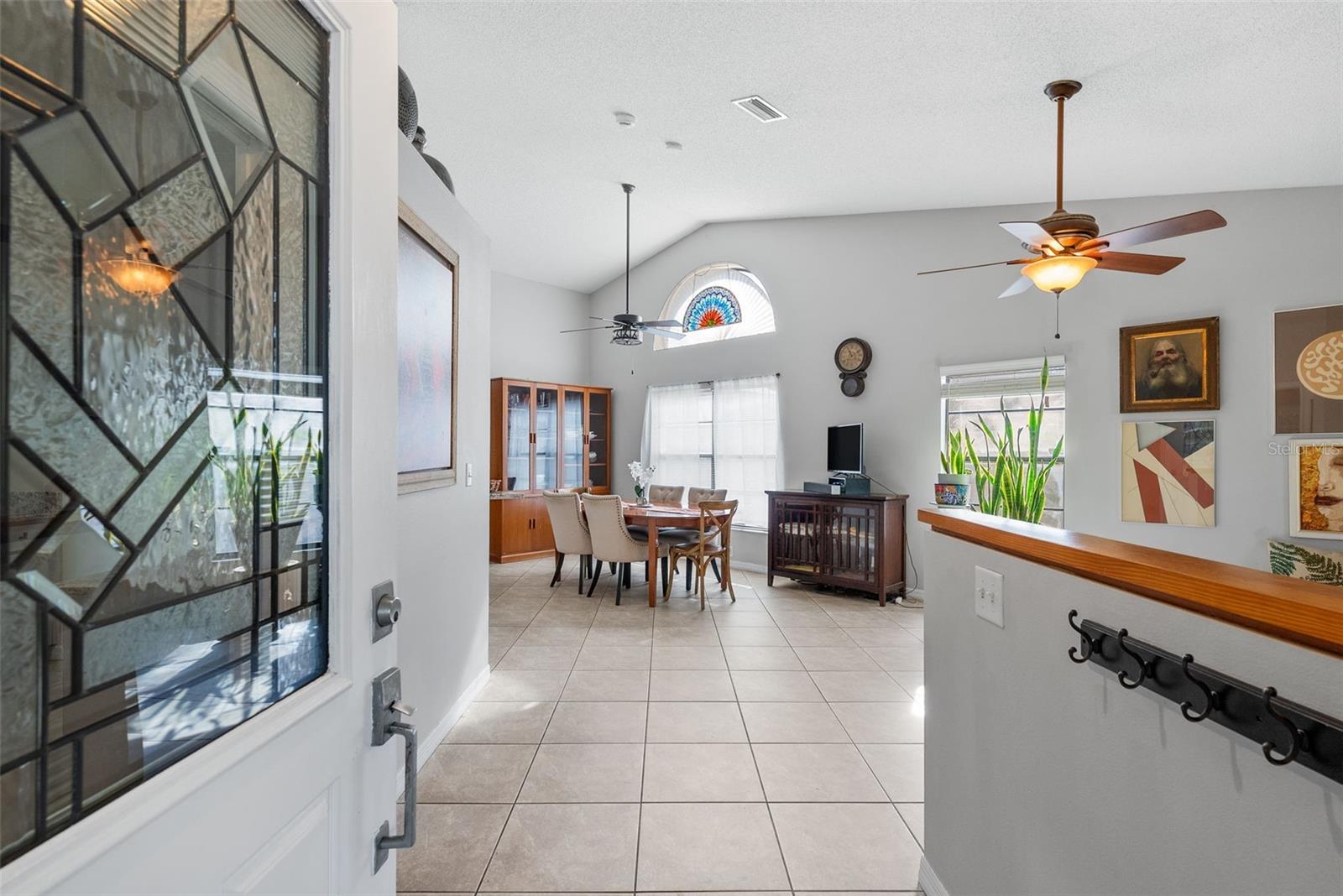 High vaulted ceilings and the living room/dinning room combo greet you as you walk into the home