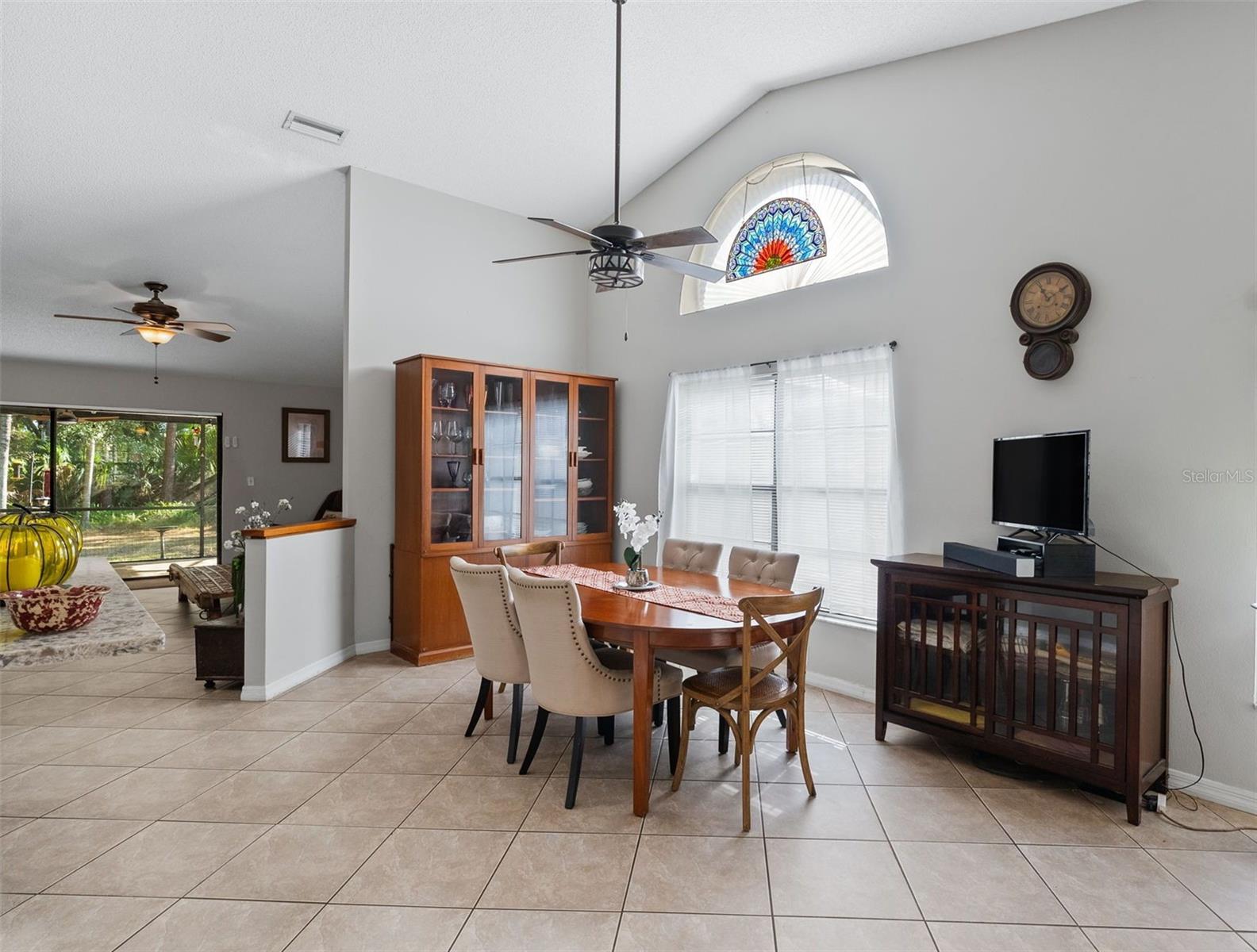 View of the dining room with lots of bright light coming in.