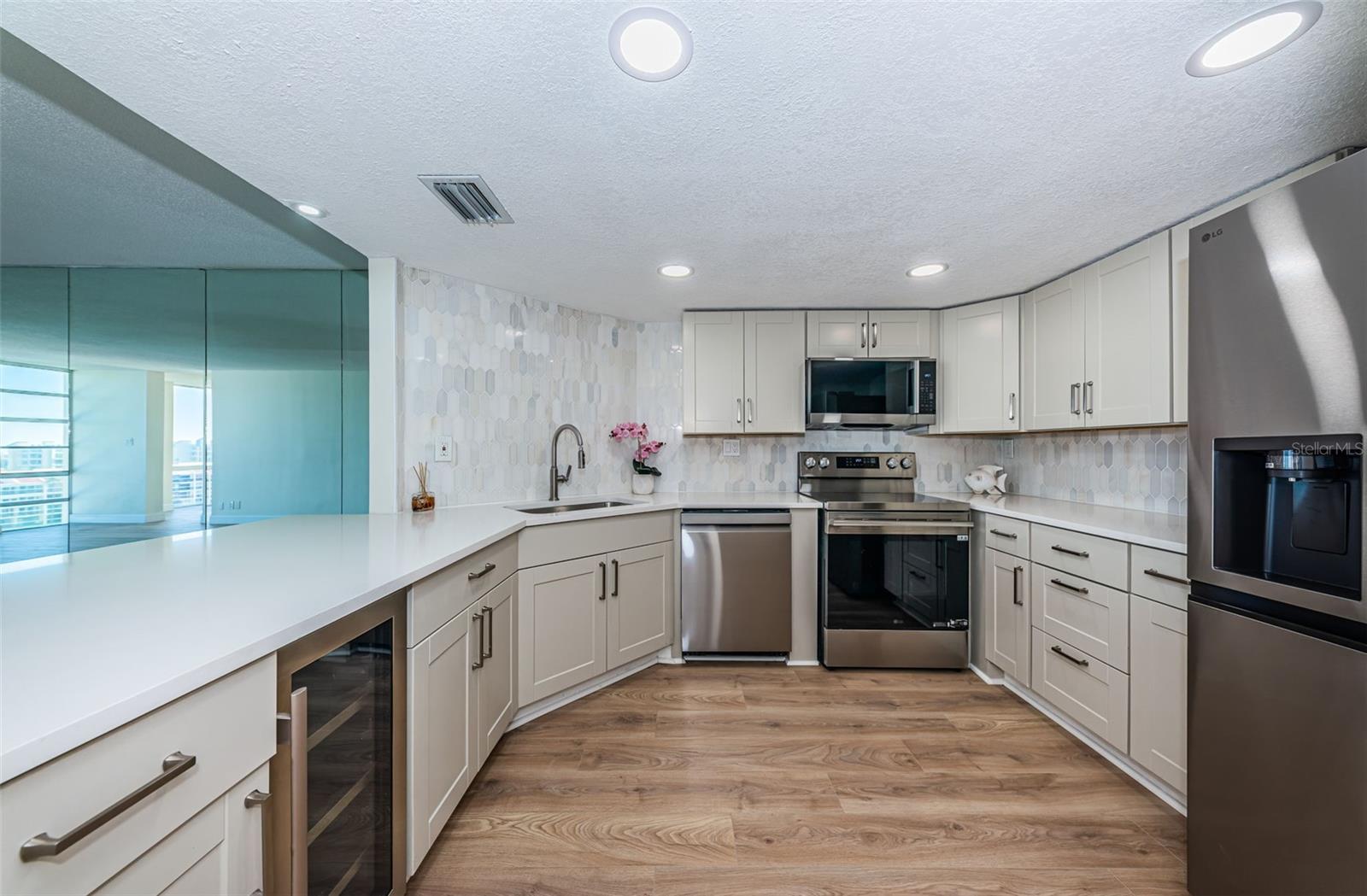 Kitchen-all new appliances and cabinets. Wine fridge.