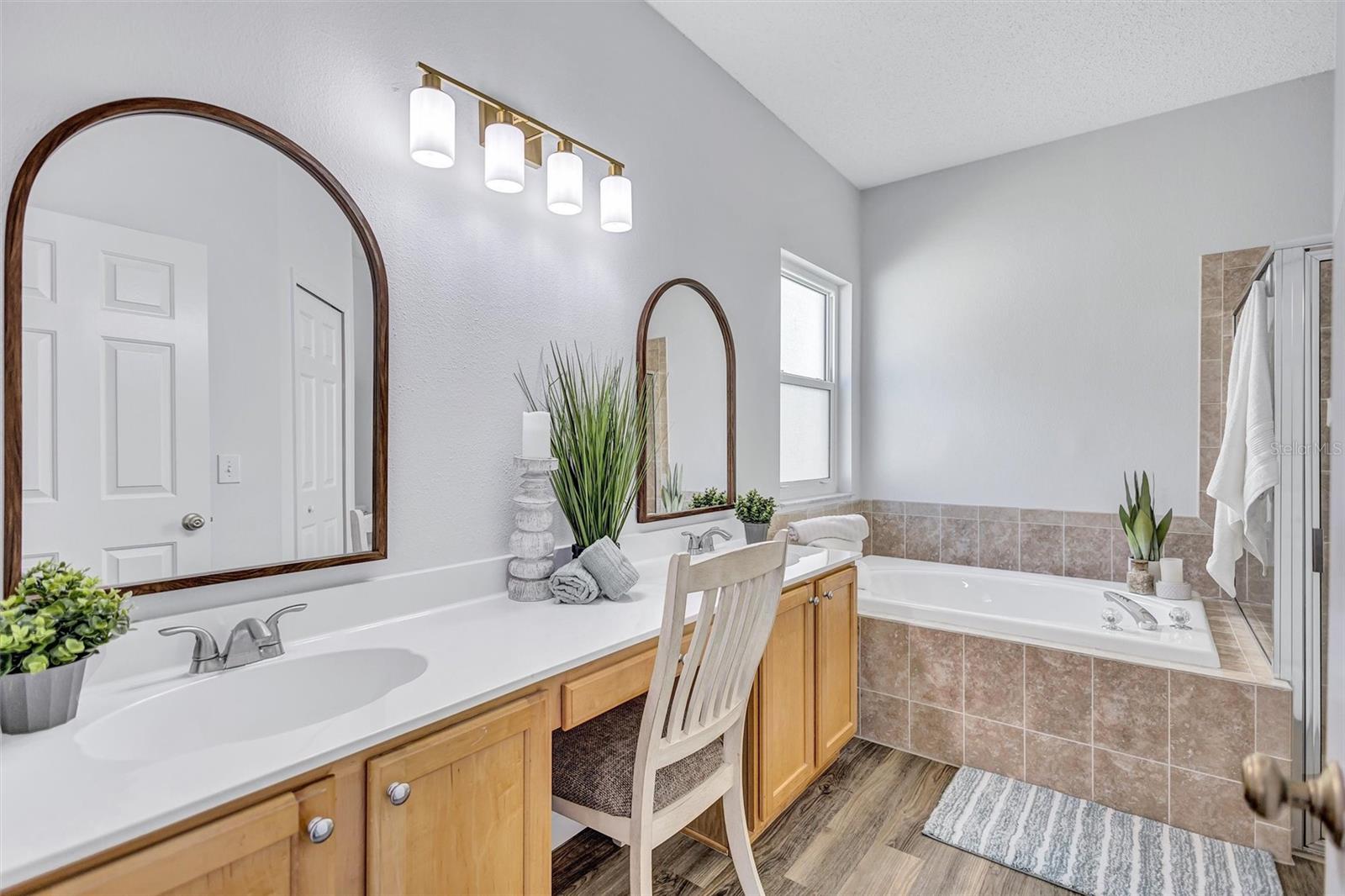 Primary ensuite bathroom with dual sinks