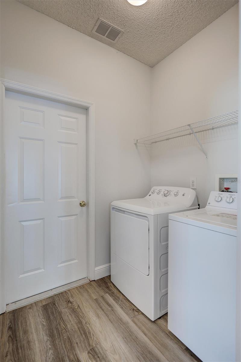 Separate enclosed laundry room