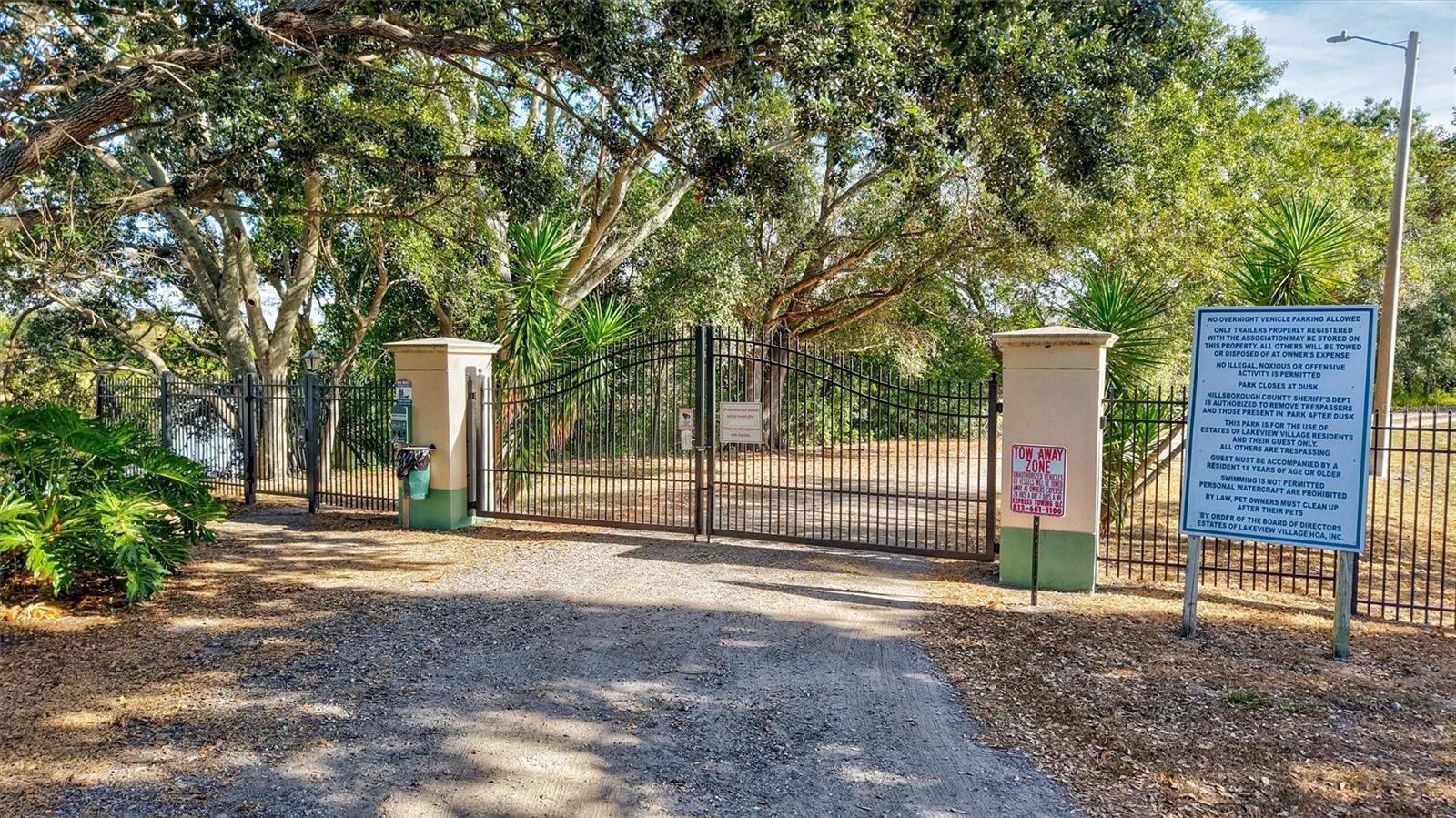 Coded pedestrian and keyed vehicle access to private boat ramp.