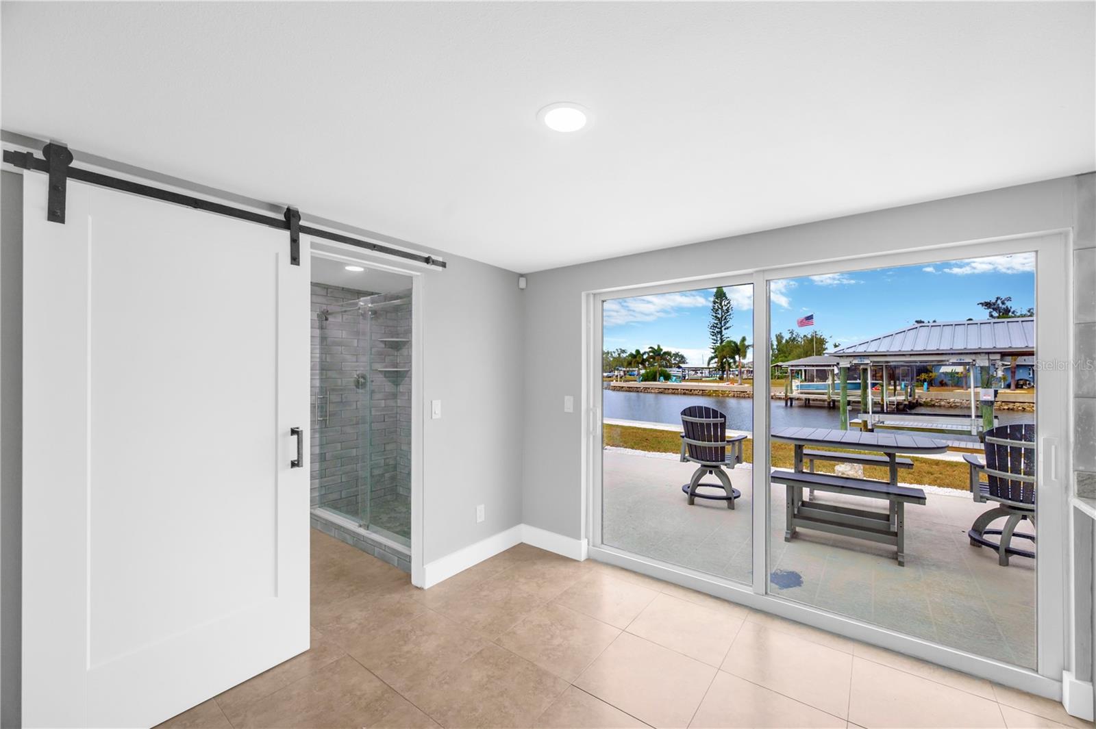 Sliding barn door leading to Bathroom #2 and laundry room.