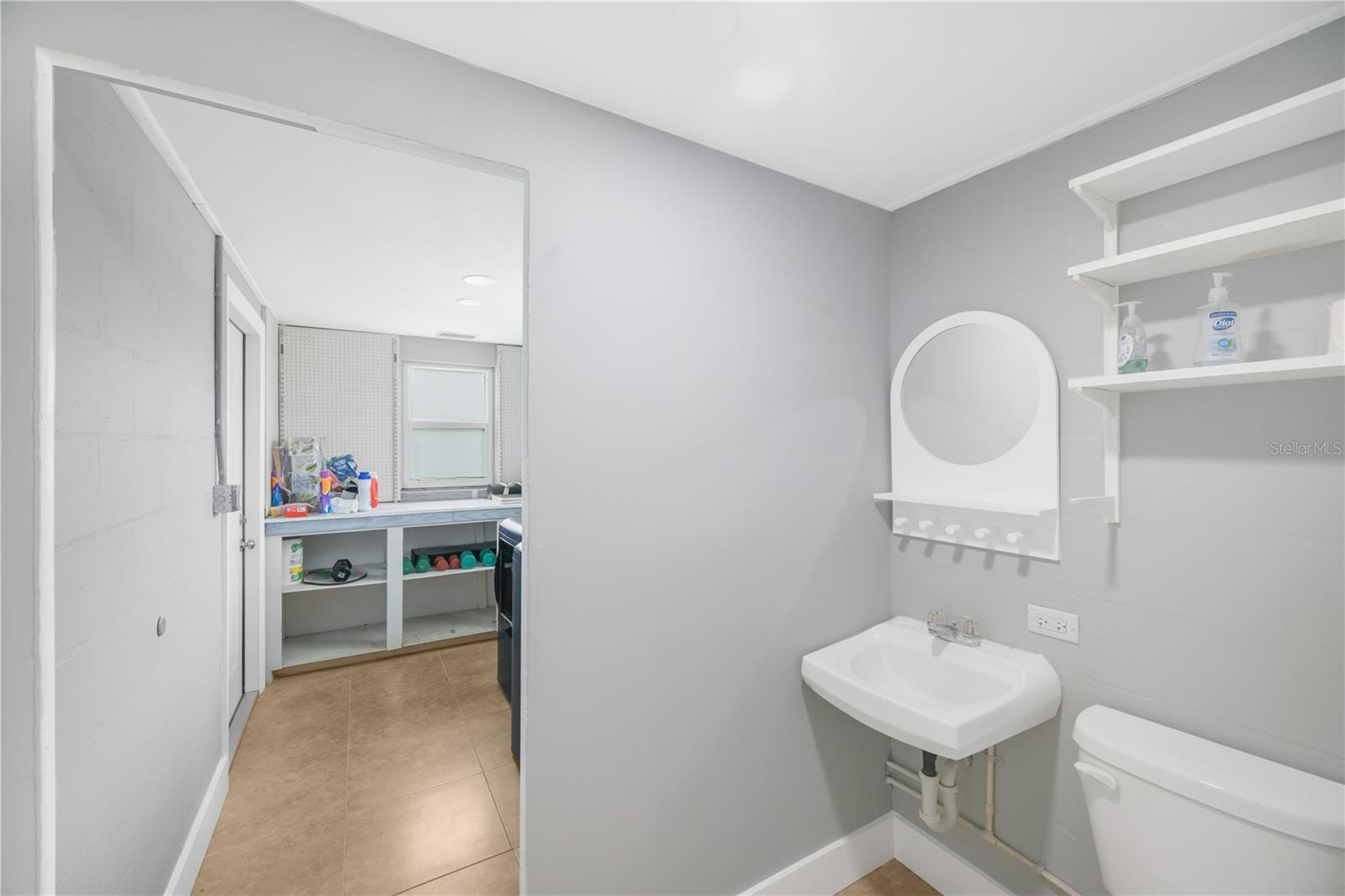 Bathroom #2 adjacent the Laundry room and Kitchen.