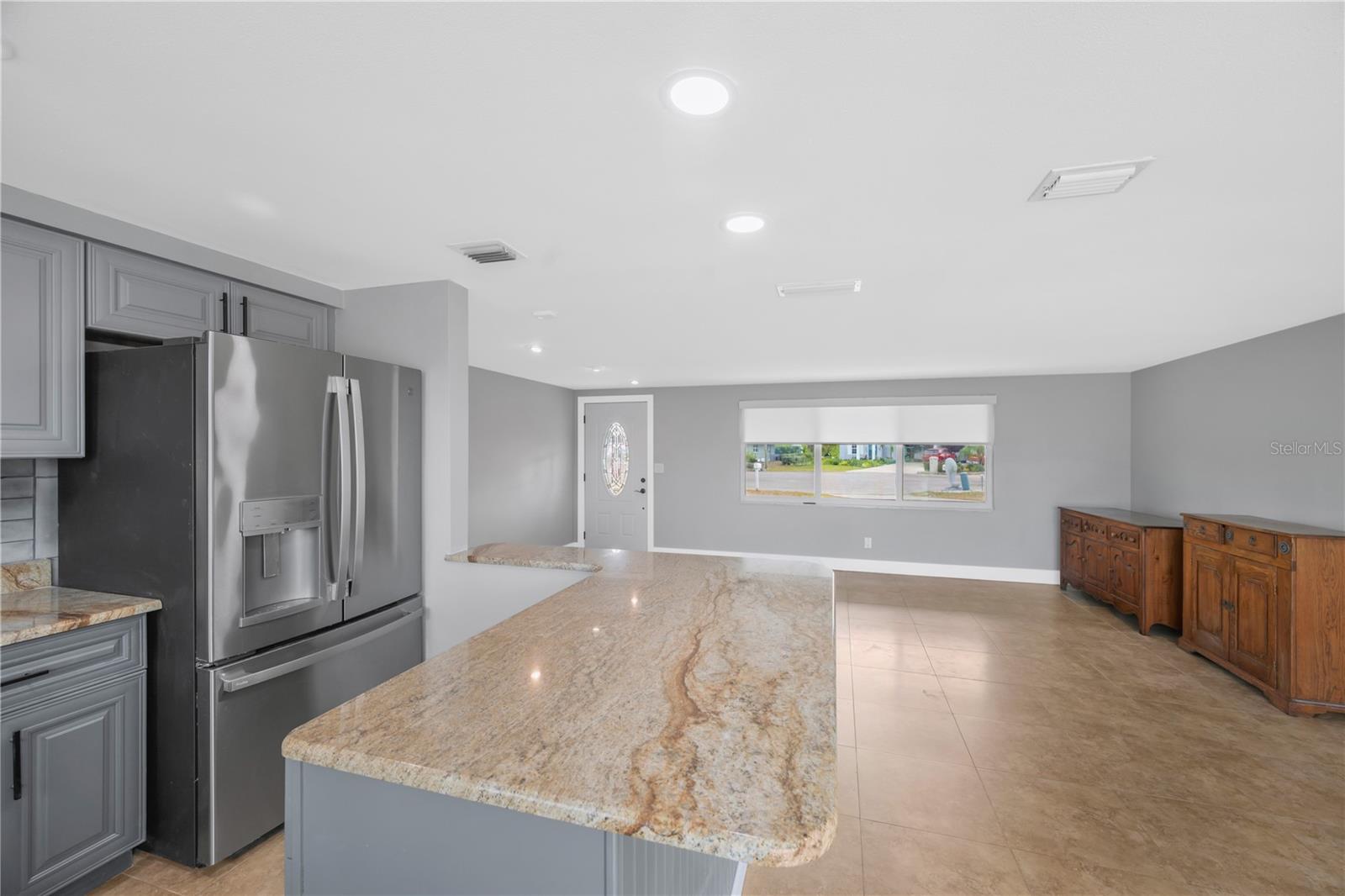 This handy breakfast bar provides additional seating along with a large work surface.