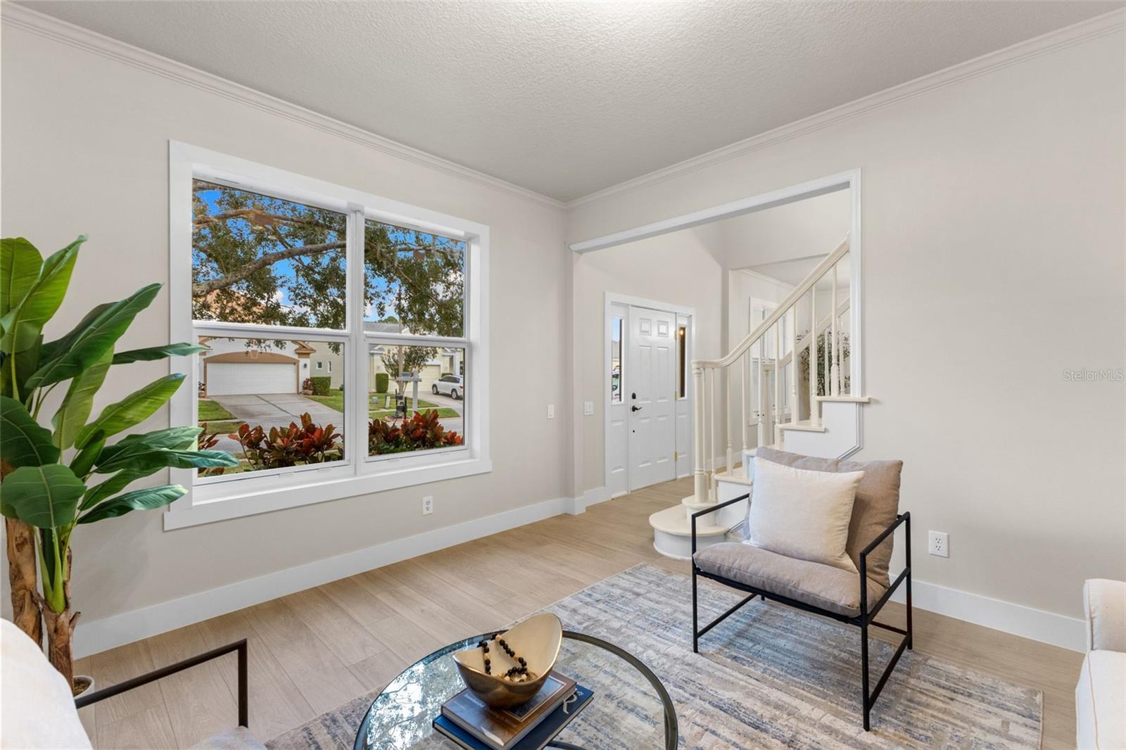 At the front of the home, a spacious formal dining room sets the stage for memorable gatherings.
