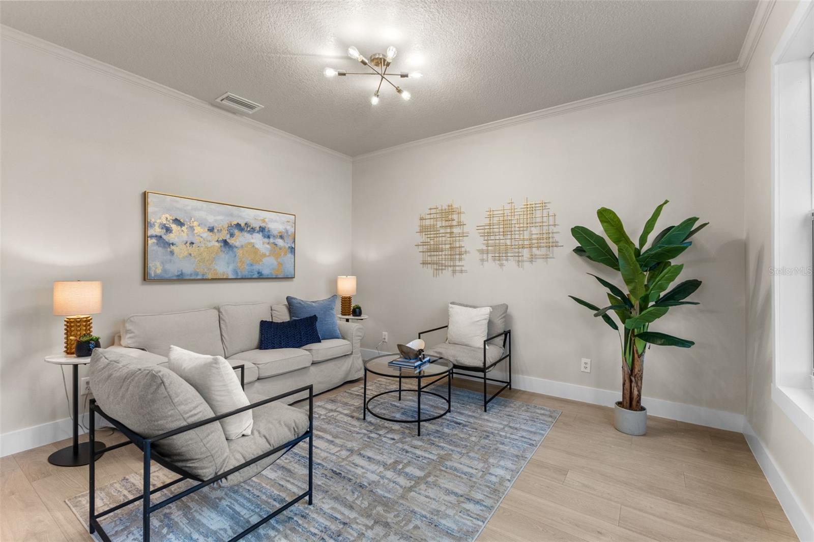 At the front of the home, a spacious formal dining room sets the stage for memorable gatherings.