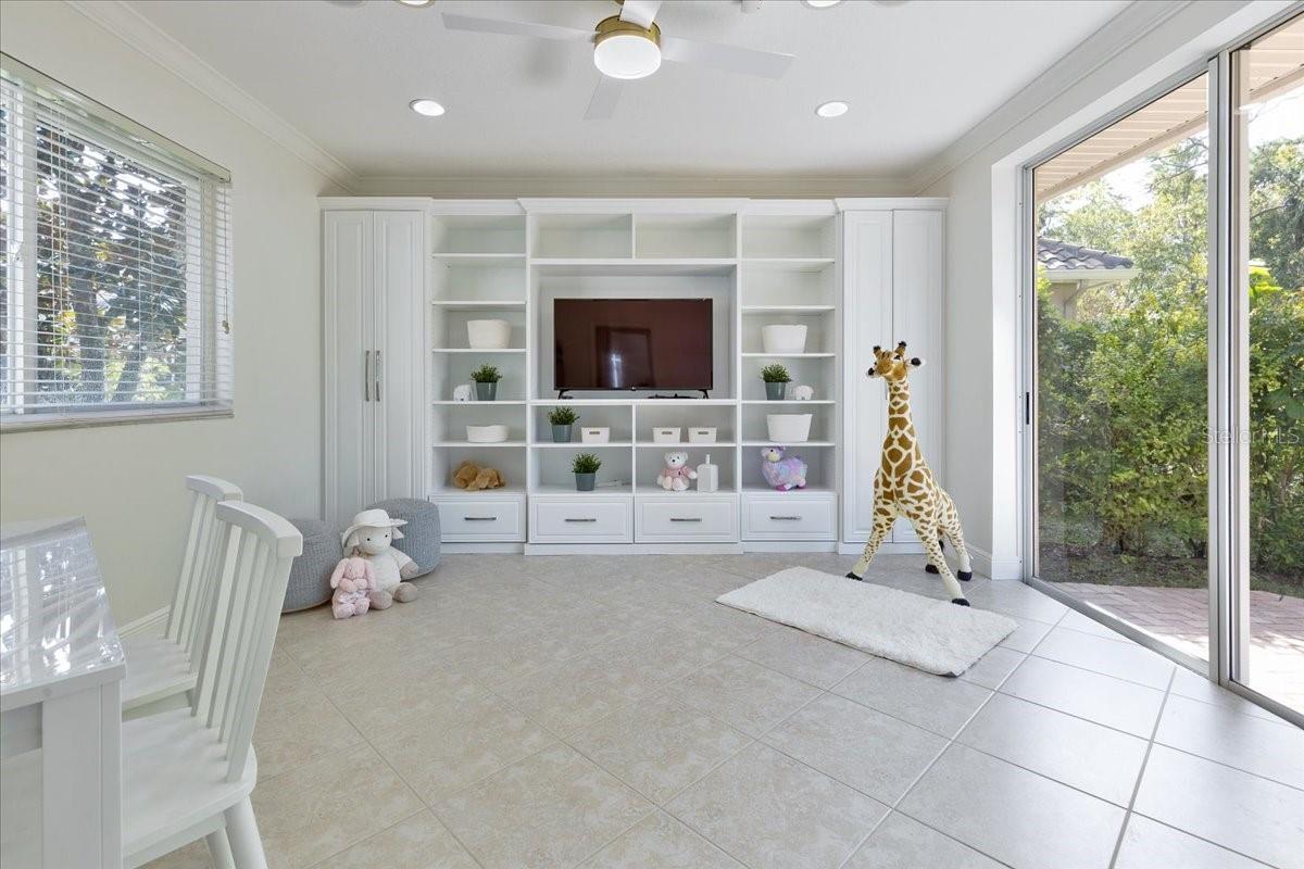Bonus Room with Custom Built Ins and Slider Access to Back Patio