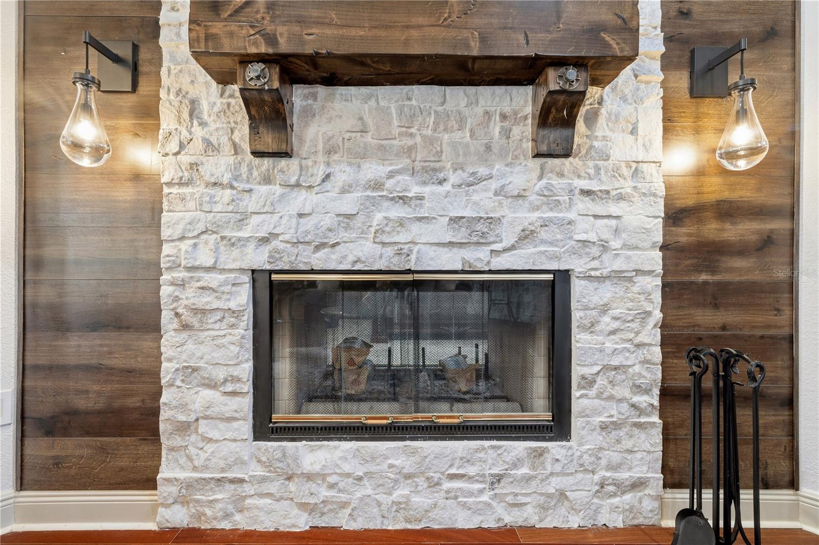 Recently remodeled electric fireplace with custom stone work.