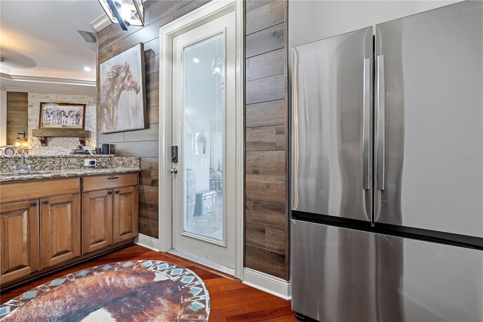 Door leading out to back patio area from the wet bar.  Great for entertaining.