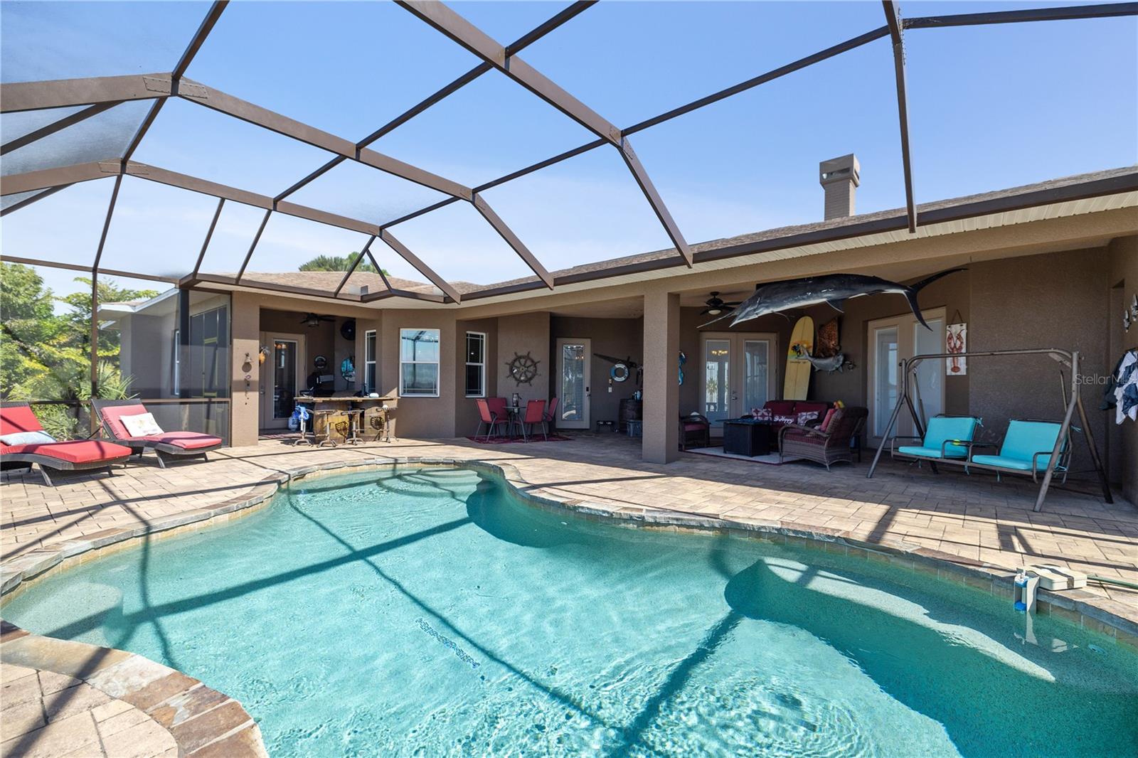 Plenty of room on screened-in enclosure to entertain.