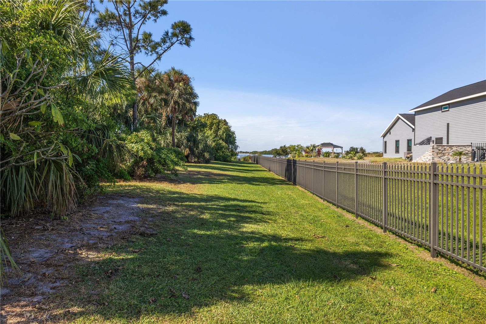 Side yard big enough to drive a truck down.