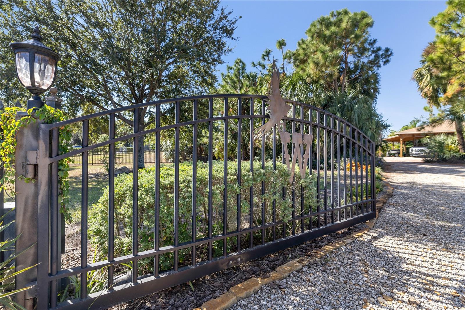 Electric gate with security code for entry.