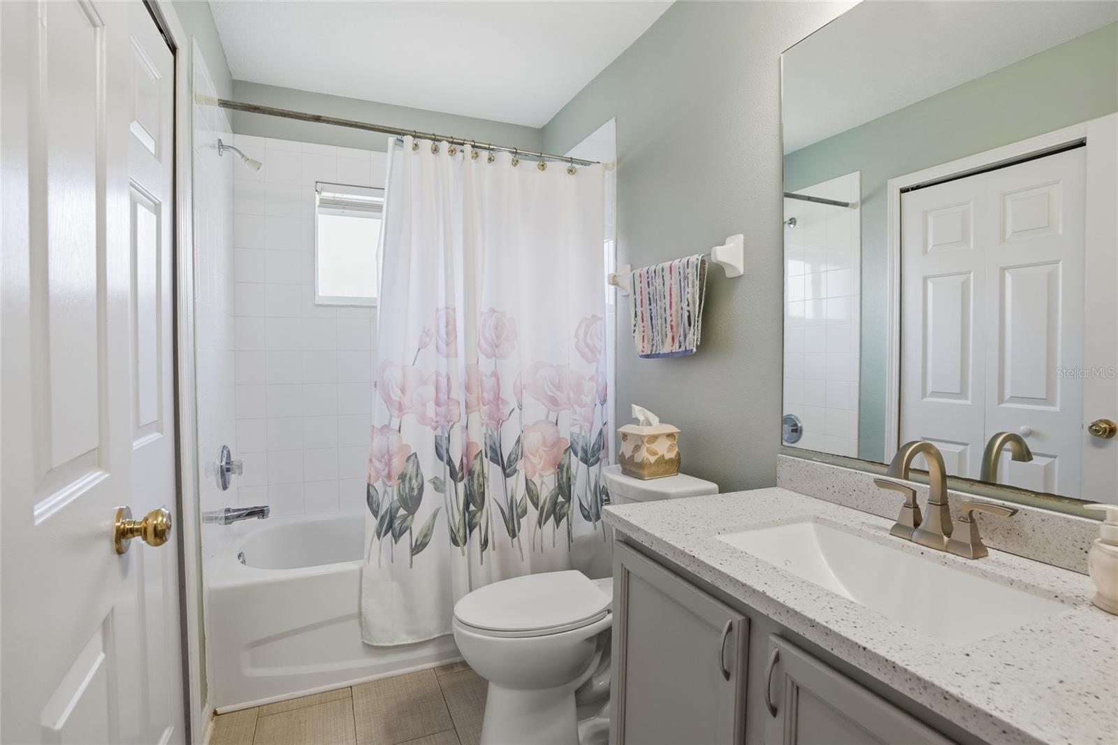 2nd upgraded bath with Quartz and beautiful tile flooring
