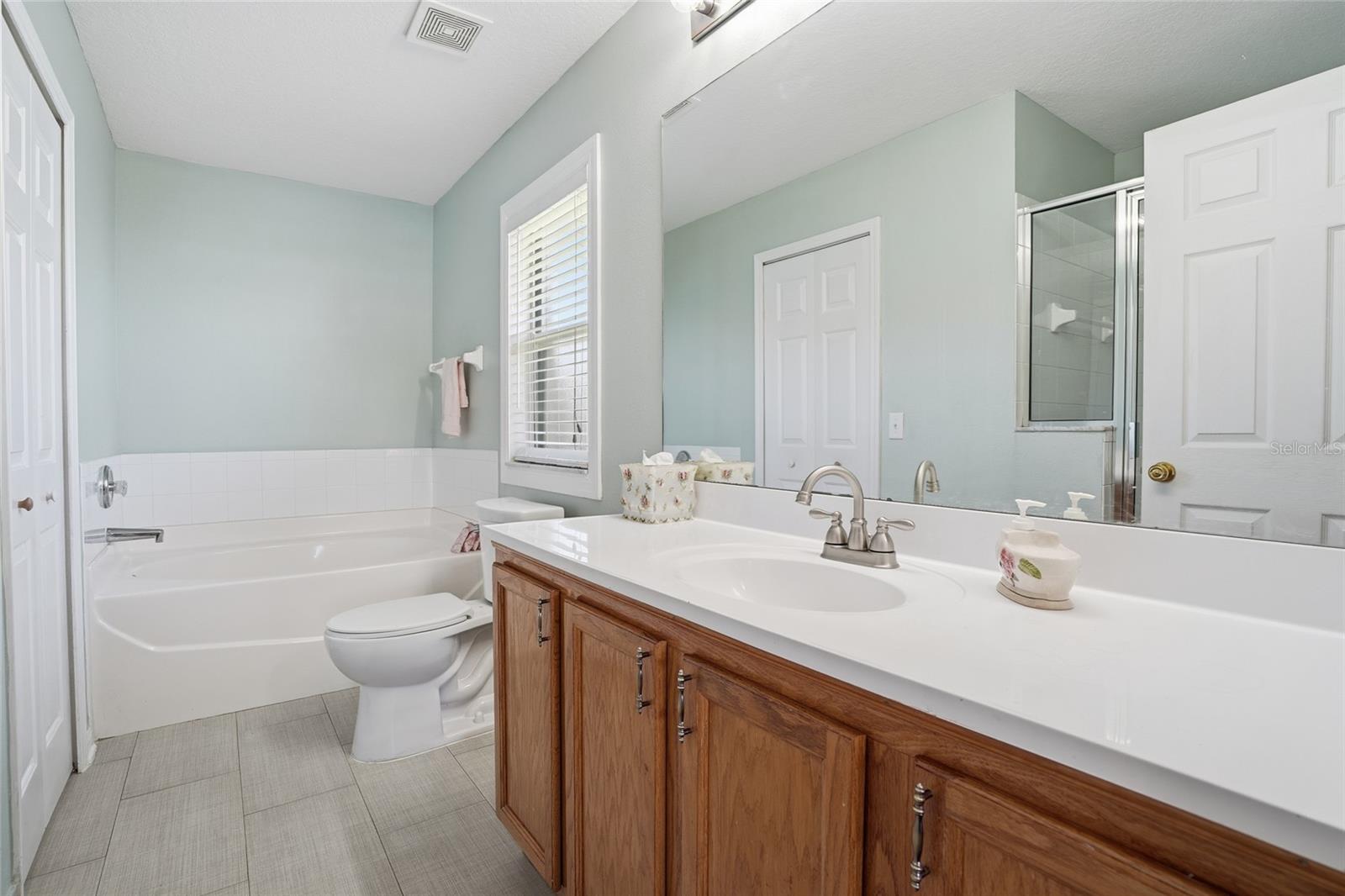 updated primary bath with soaking tub and separate shower