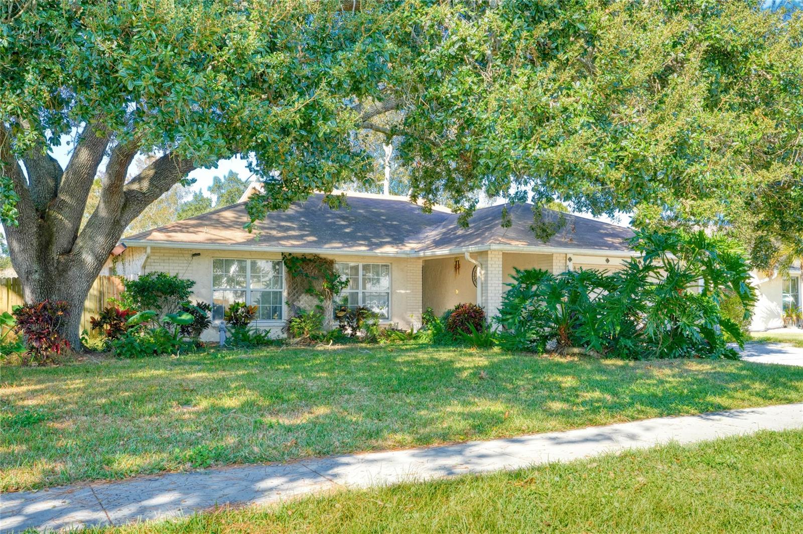 Welcome to 1432 Windmill Pointe - a 5 Bedroom 3 Bathroom 2 Car Garage home nestled in a quiet subdivision in Palm Harbor