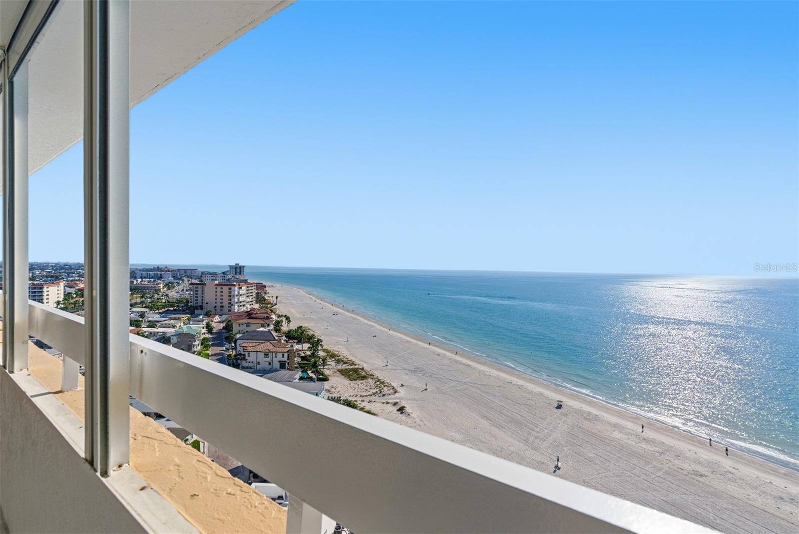 Endless shoreline and sparkling Gulf waters create a stunning backdrop from this 16th-floor balcony.