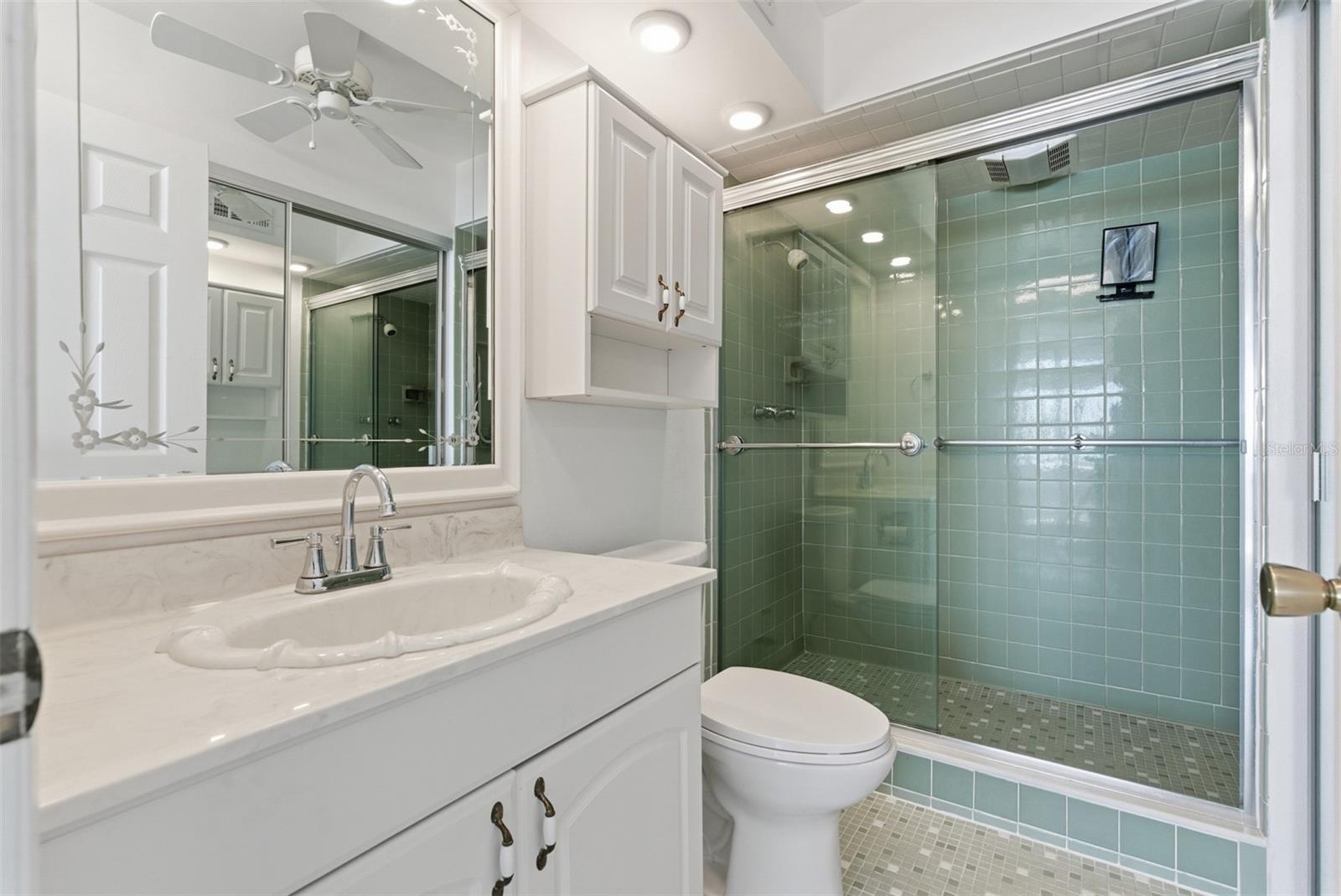 En-suite primary bath with walk-in shower.