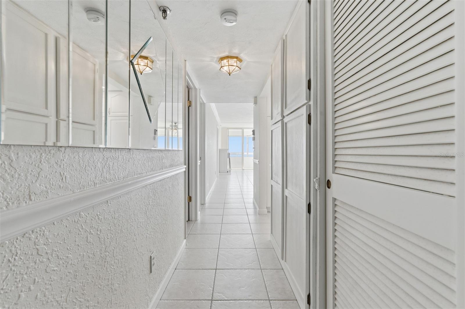 Bright entry foyer leads your eye straight to the Gulf-view living area beyond.
