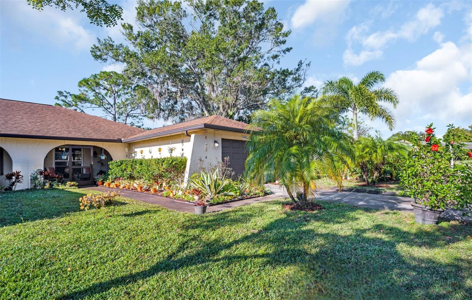Welcome home to Duplex Village I in Palm Harbor's premier 55+ golf community~