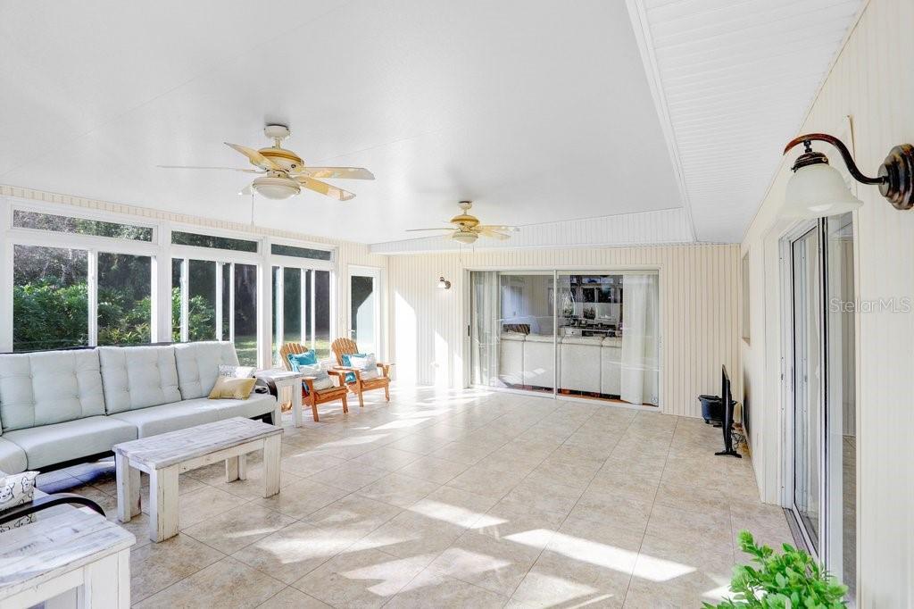 Enormous Lanai with sliders to Living Room and Dining room and pass through to kitchen