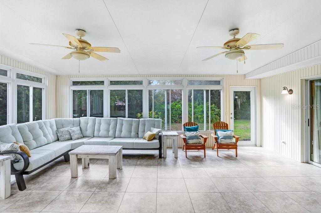 Enormous Lanai with sliders to Living Room and Dining room and pass through to kitchen