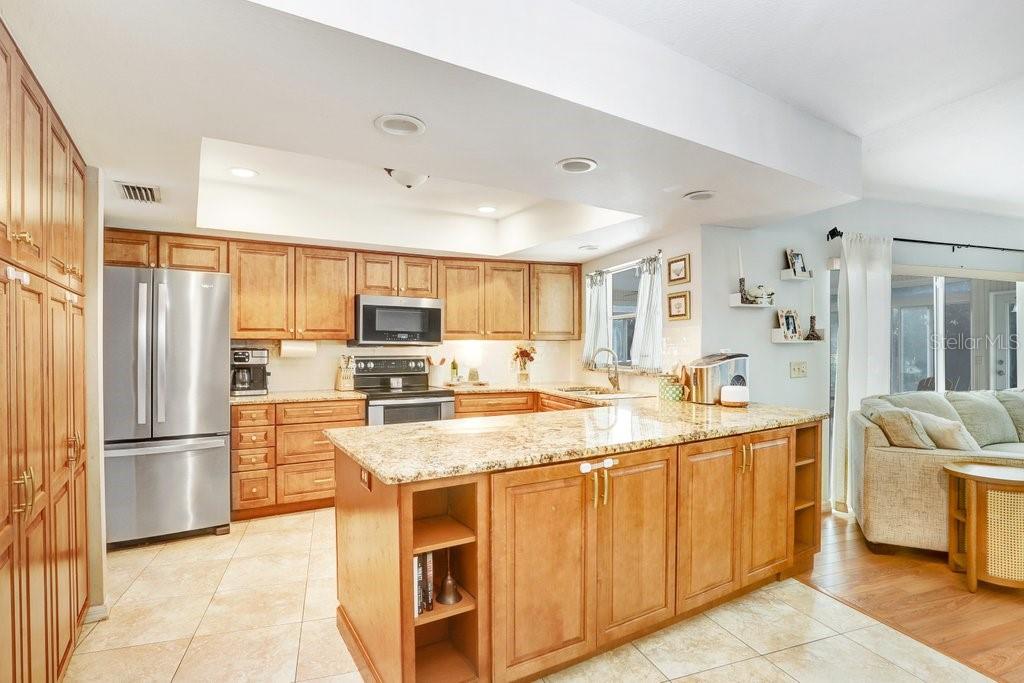 Beautiful Open  Kitchen with soft close cabinets, granite countertops and stainless steel appliances