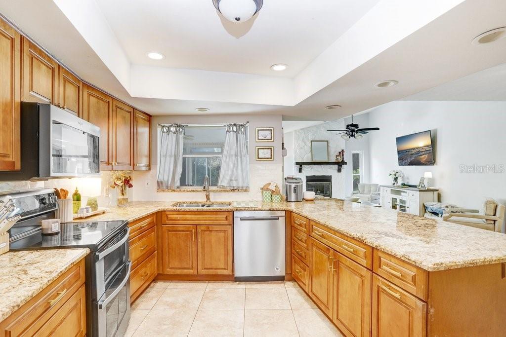 Beautiful Open  Kitchen with soft close cabinets, granite countertops and stainless steel appliances