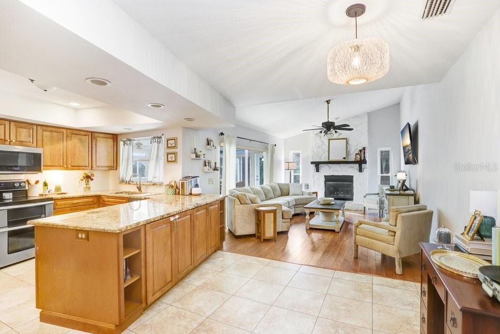 Beautiful Open  Kitchen with soft close cabinets, granite countertops and stainless steel appliances