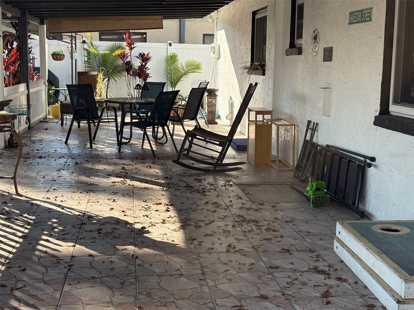 Huge covered, lighted and tiled back Patio