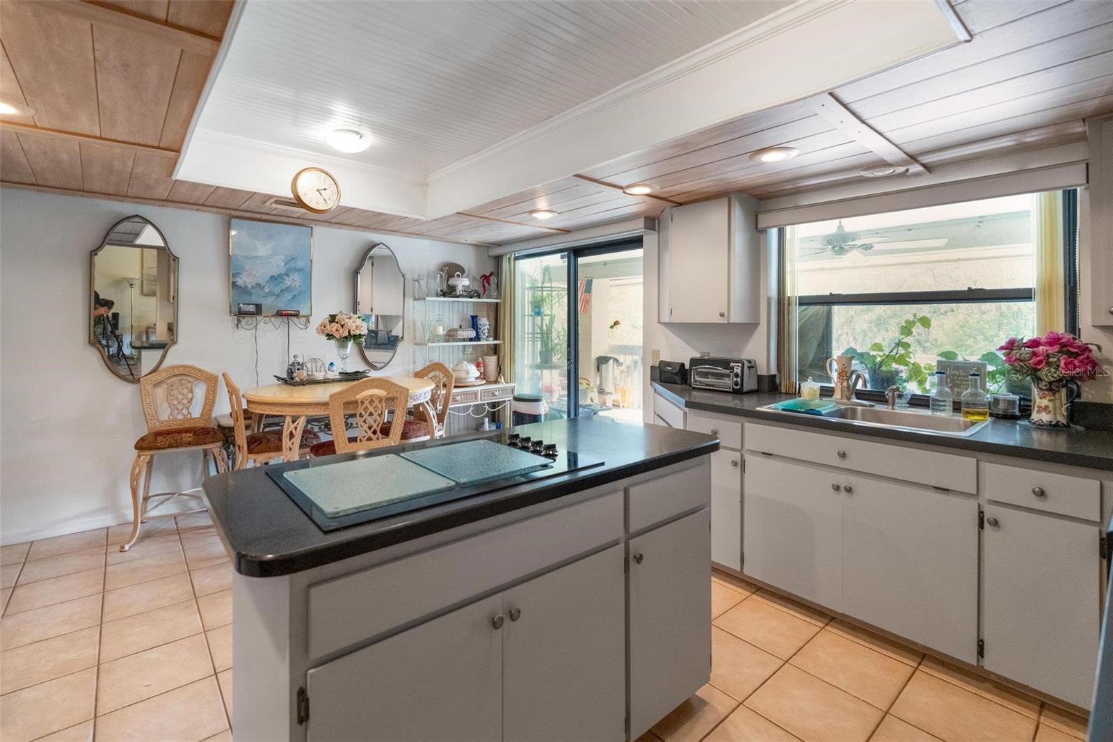 Eat in space with sliding glass door to large covered deck