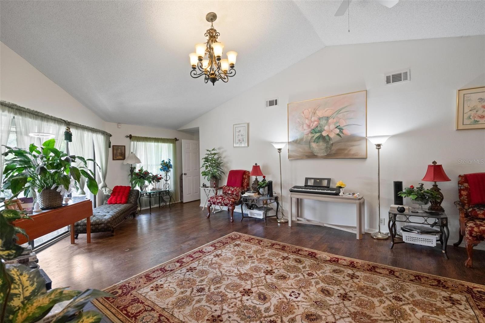 Bright Living Room with sliding doors to coverer decj