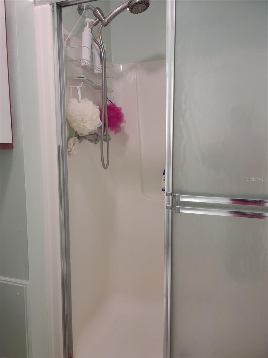 Walk in shower has updated surround.