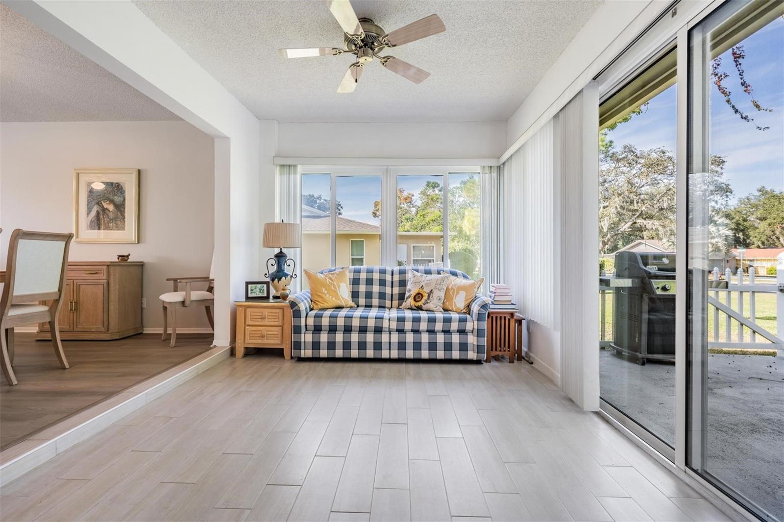 Fabulous indoor seating area with sliding glass door leading to outdoor patio